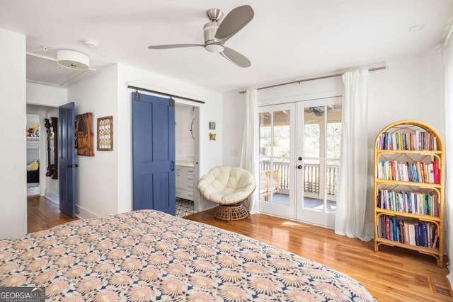 bedroom featuring ceiling fan, french doors, wood finished floors, and access to outside