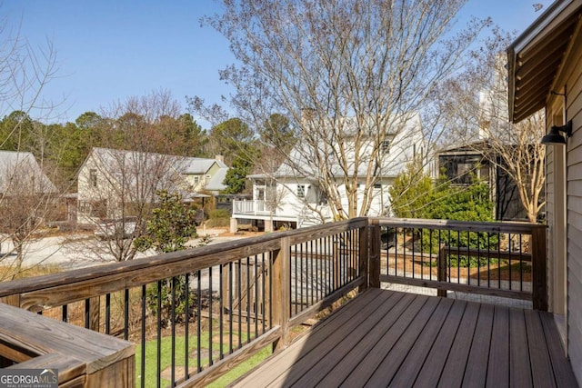 wooden terrace featuring a residential view