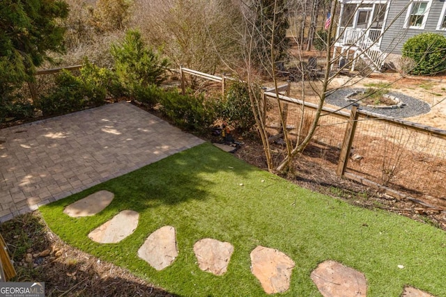 view of yard with a patio area and fence