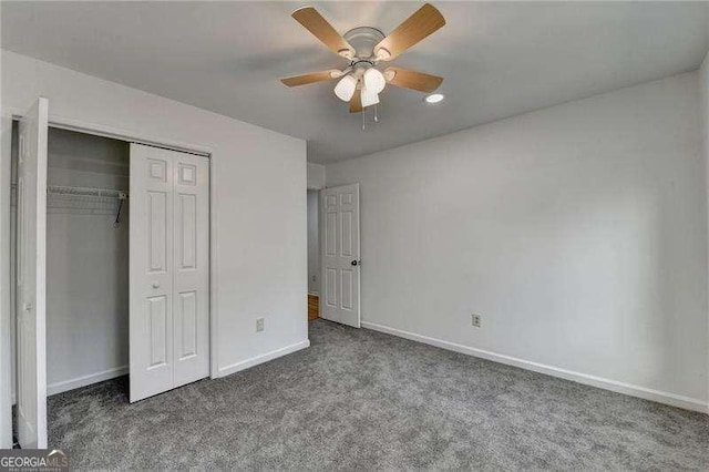 unfurnished bedroom with a closet, ceiling fan, baseboards, and carpet