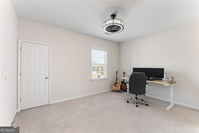 home office with carpet flooring, visible vents, and baseboards