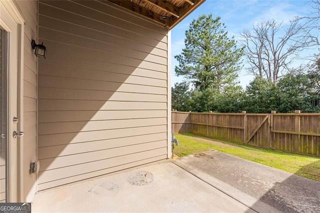 view of patio / terrace featuring fence