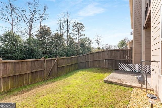 view of yard featuring a patio and a fenced backyard