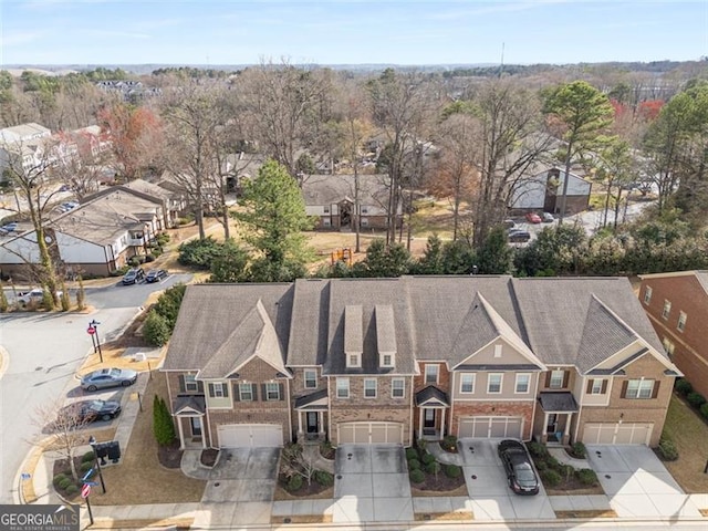 birds eye view of property with a residential view