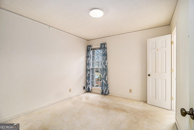 carpeted spare room with baseboards