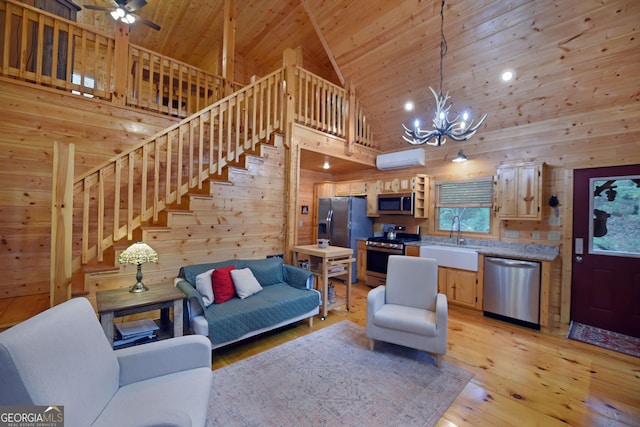 living room featuring stairway, wood walls, wood ceiling, light wood-style flooring, and a wall mounted AC