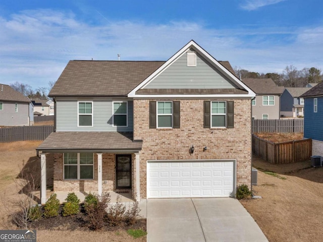 340 Layfield Dr, Jonesboro, GA 30238 - traditional-style home featuring brick siding, concrete driveway, and fence