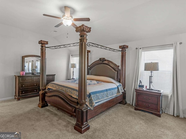 bedroom featuring baseboards, visible vents, lofted ceiling, ceiling fan, and light carpet