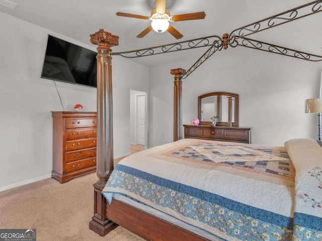 carpeted bedroom with a ceiling fan and baseboards