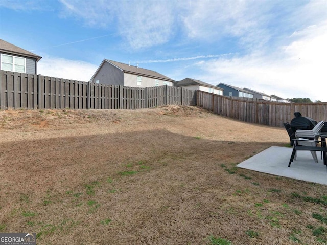 view of yard featuring a fenced backyard and a patio area