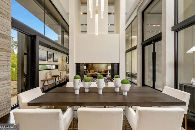 unfurnished dining area featuring a high ceiling and radiator