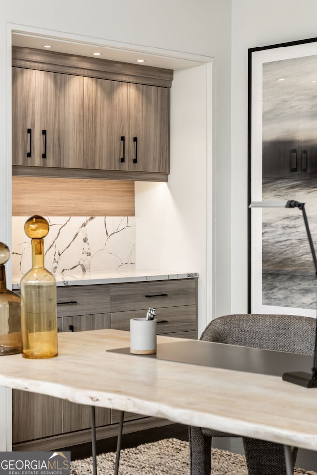 kitchen featuring light countertops and tasteful backsplash