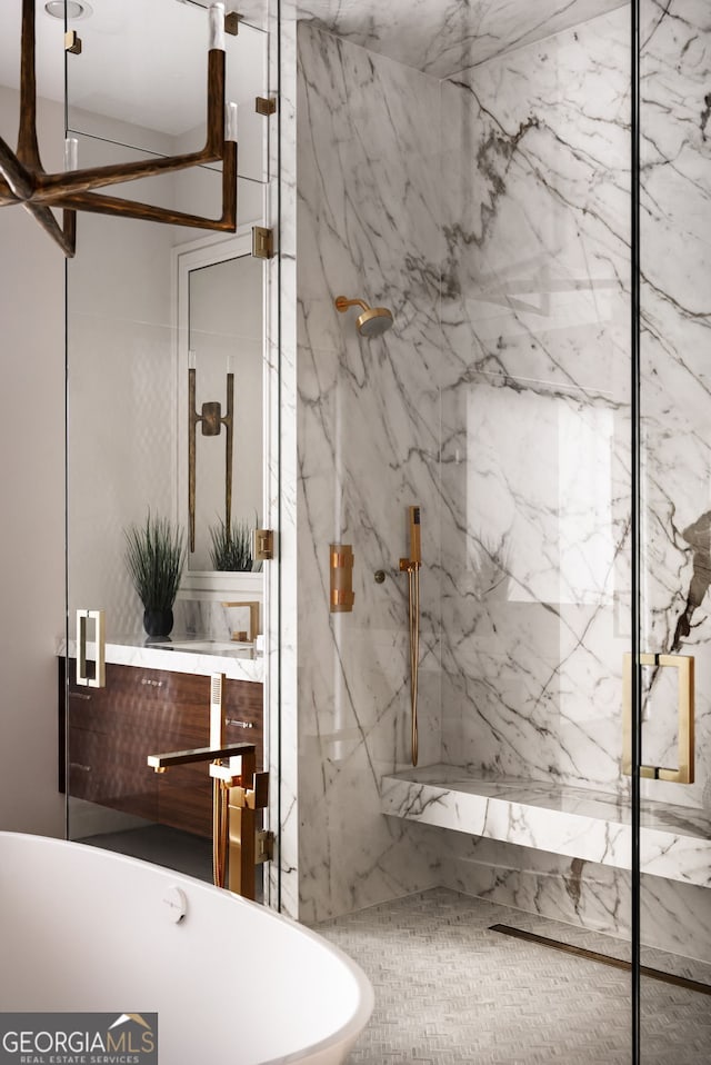 full bathroom featuring a marble finish shower