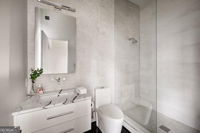 full bath featuring backsplash, a walk in shower, toilet, and tile walls