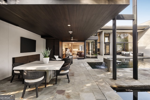 view of patio / terrace featuring outdoor dining space, an outdoor pool, an outdoor hangout area, and ceiling fan