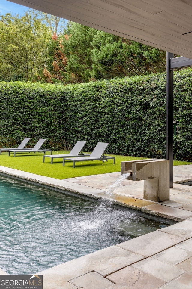 exterior space featuring a patio, a yard, and fence