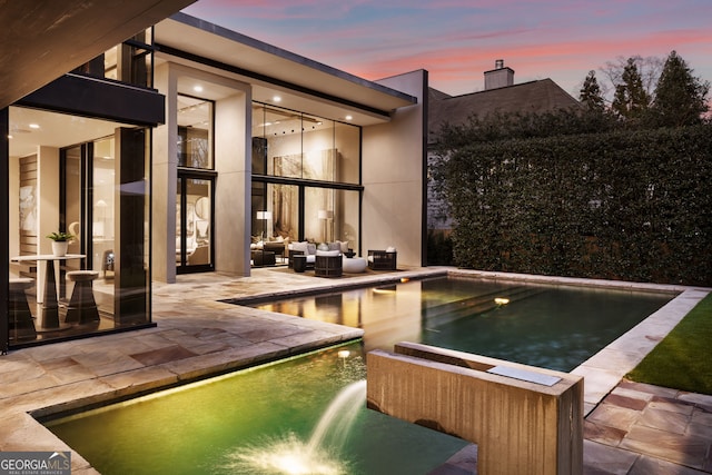 view of pool featuring a patio area and an outdoor living space