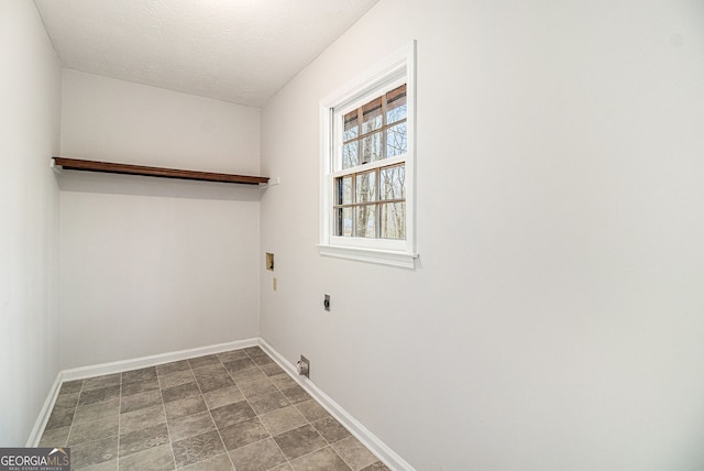 laundry area with electric dryer hookup, baseboards, hookup for a washing machine, and laundry area