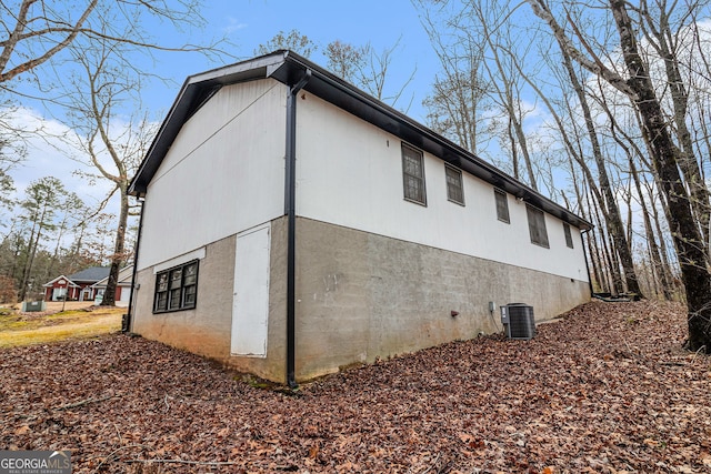 view of home's exterior with central AC unit