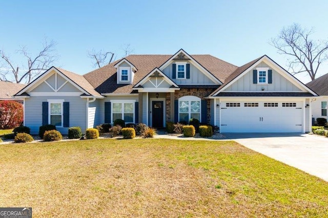 craftsman inspired home with driveway, a front lawn, and board and batten siding