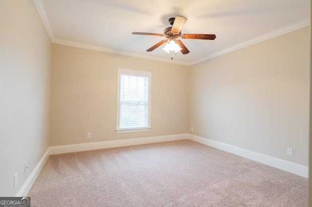 spare room with light carpet, a ceiling fan, baseboards, and ornamental molding