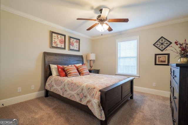 bedroom featuring crown molding, baseboards, carpet floors, and ceiling fan