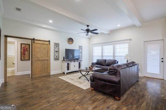 living room with beamed ceiling, visible vents, a barn door, and wood finished floors