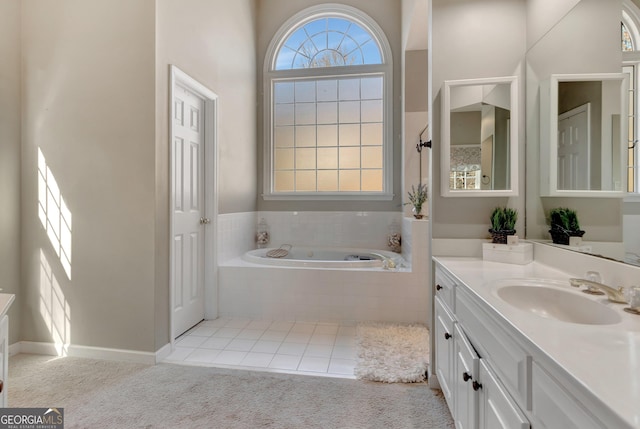 full bath with vanity, a garden tub, baseboards, and tile patterned flooring