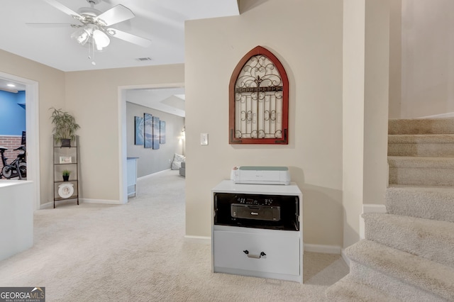 hallway with carpet flooring, stairway, and baseboards