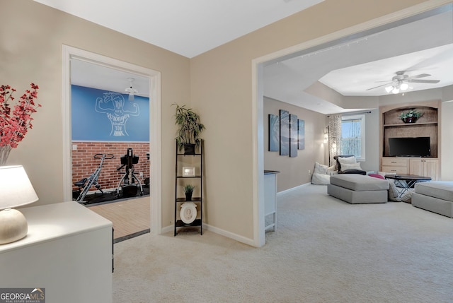 interior space with ceiling fan and baseboards