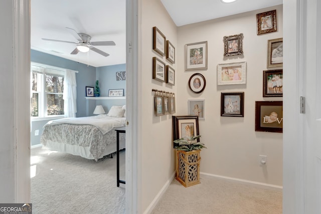 bedroom with a ceiling fan, visible vents, carpet, and baseboards