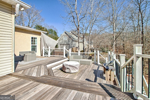 wooden terrace with an outdoor structure