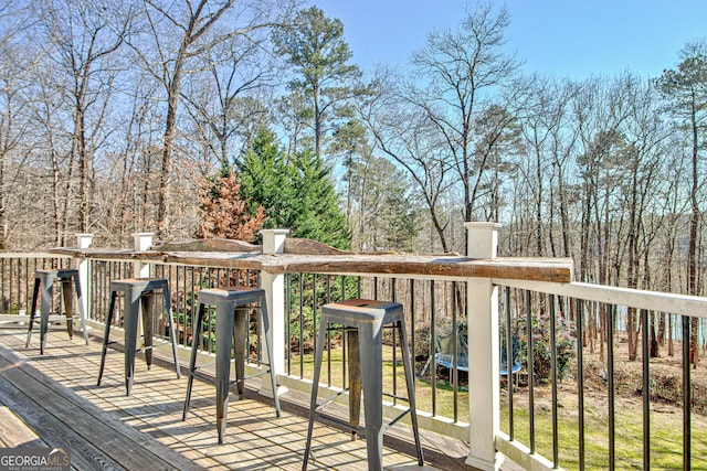 wooden deck featuring a trampoline