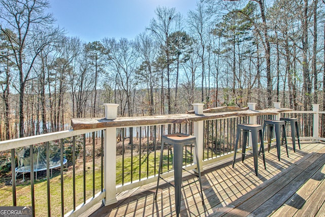 wooden deck featuring a wooded view