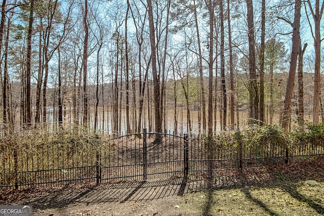 view of gate featuring fence