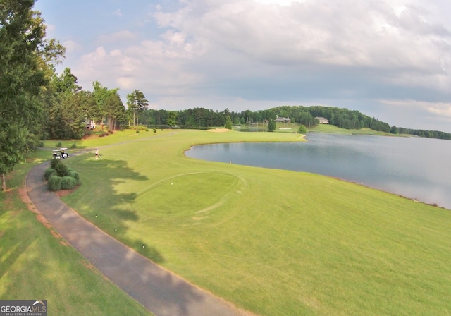 view of community featuring golf course view and a water view