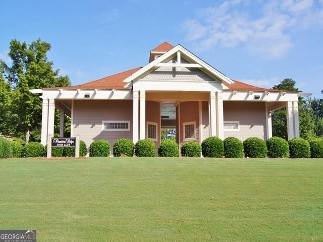 craftsman-style home with a front yard