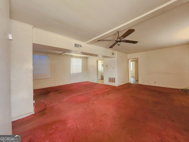 unfurnished room featuring beam ceiling, carpet flooring, visible vents, and ceiling fan