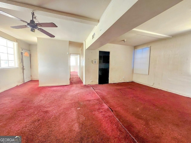 spare room featuring visible vents, ceiling fan, and carpet flooring