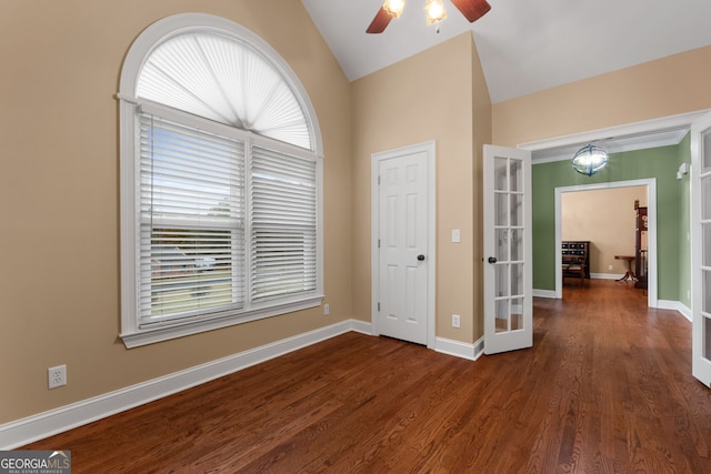 interior space featuring a wealth of natural light, french doors, dark wood-style flooring, and vaulted ceiling