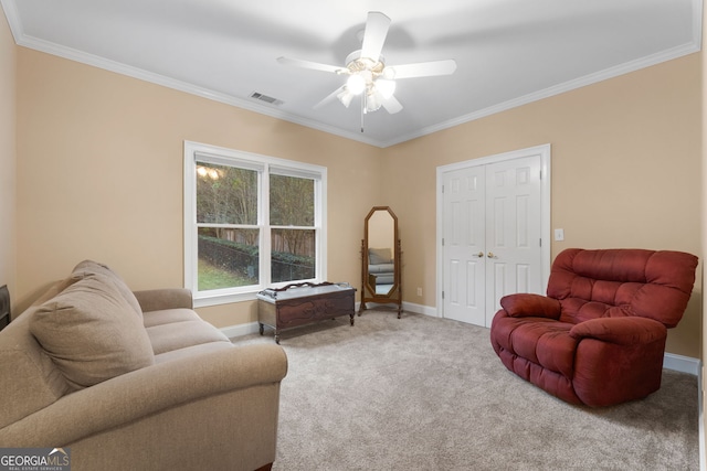 carpeted living room with baseboards, visible vents, and ornamental molding