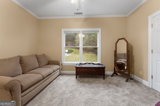 living room featuring visible vents, ornamental molding, baseboards, light colored carpet, and ceiling fan