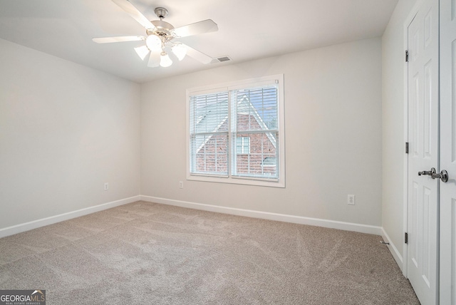 unfurnished bedroom featuring carpet, visible vents, baseboards, ceiling fan, and a closet