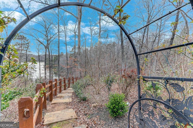 view of yard with a forest view