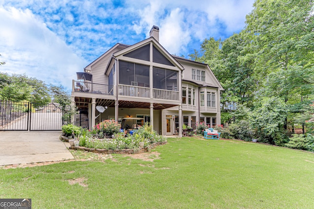 3845 Starboard Pt, Gainesville, GA 30506 - rear view of property featuring a chimney, a sunroom, a gate, driveway, and a patio