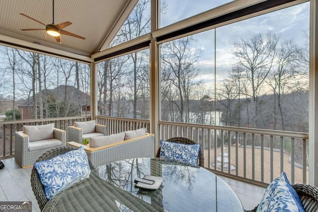 sunroom / solarium featuring vaulted ceiling and a ceiling fan