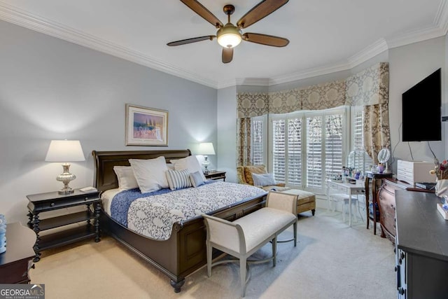 bedroom with a ceiling fan, crown molding, and light colored carpet