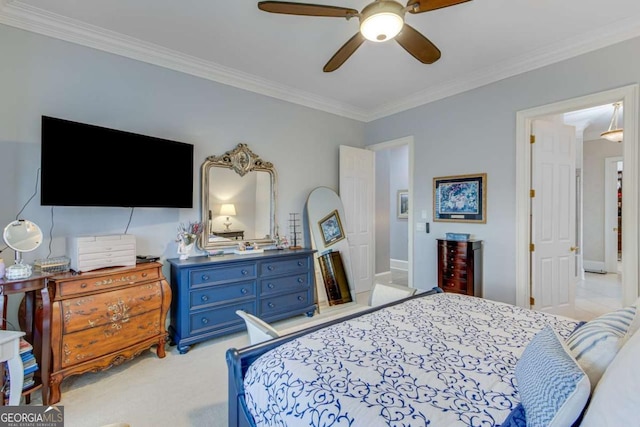 bedroom featuring ceiling fan, light carpet, and ornamental molding