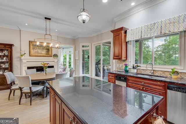 3845 Starboard Pt, Gainesville, GA 30506 - kitchen featuring stainless steel dishwasher, a sink, tasteful backsplash, light wood-type flooring, and decorative light fixtures
