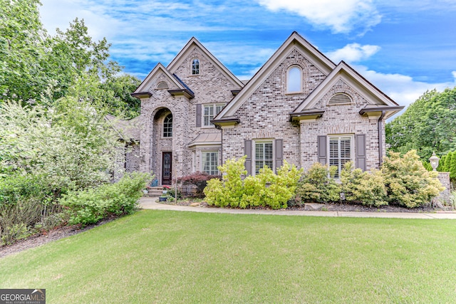 3845 Starboard Pt, Gainesville, GA 30506 - french country home with brick siding and a front lawn